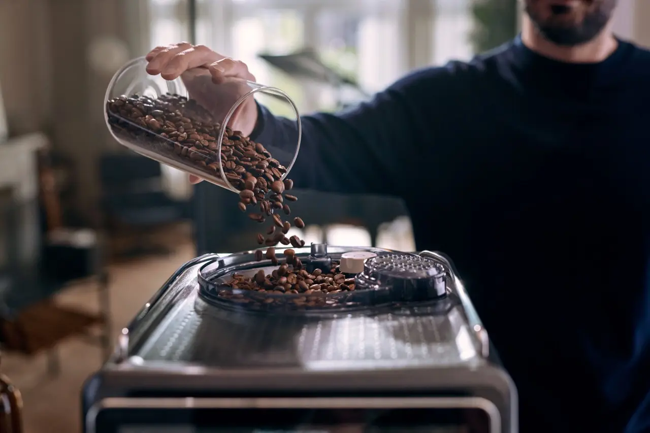 Coffee beans put into coffee machine